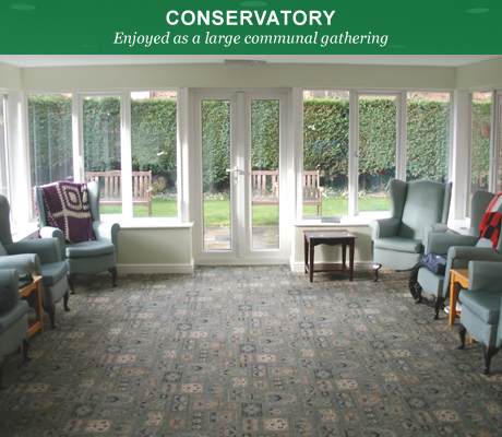 Bright conservatory with seating for residents