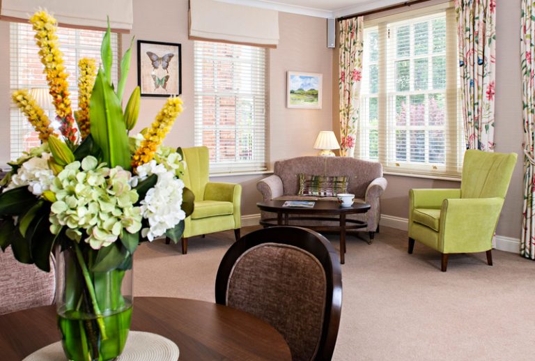 Cozy common area with comfortable seating and flowers