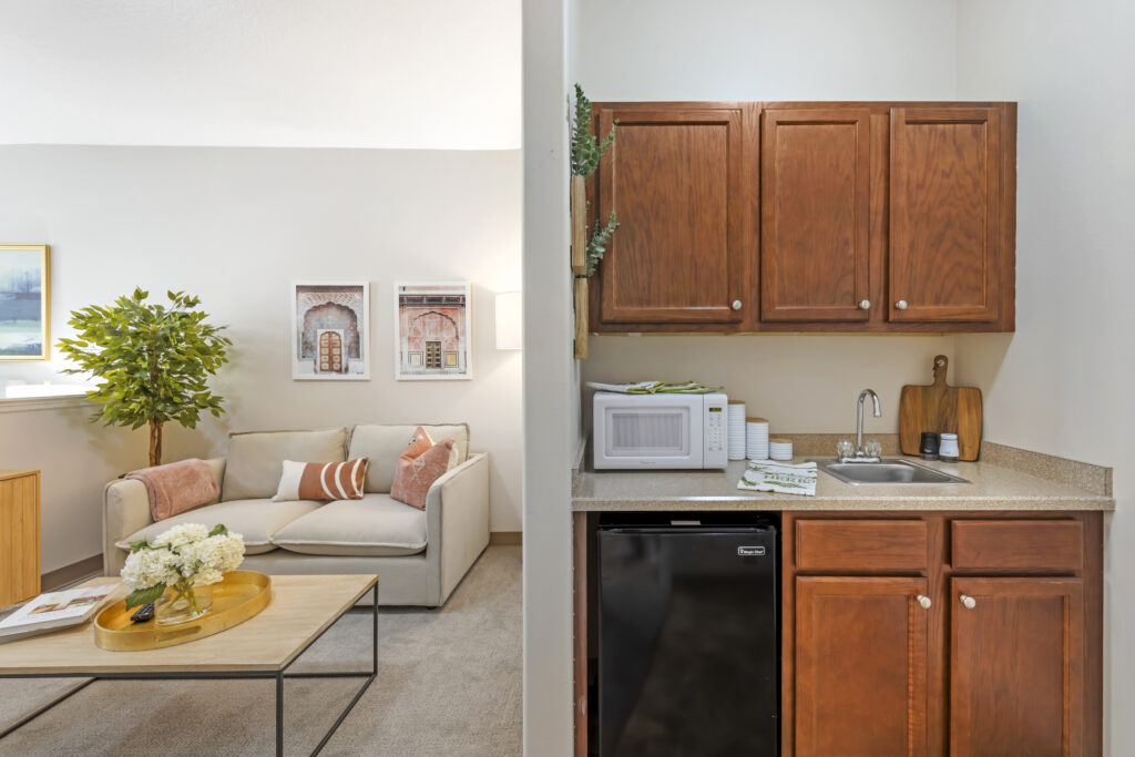 Cozy living area with kitchenette and seating.