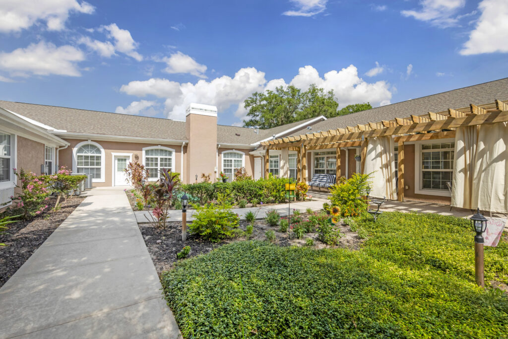 Beautiful outdoor courtyard with gardens and seating.