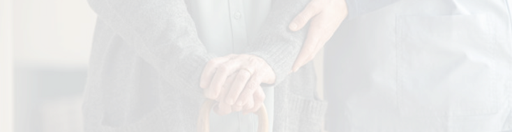 Close-up of hands of a caregiver and a resident