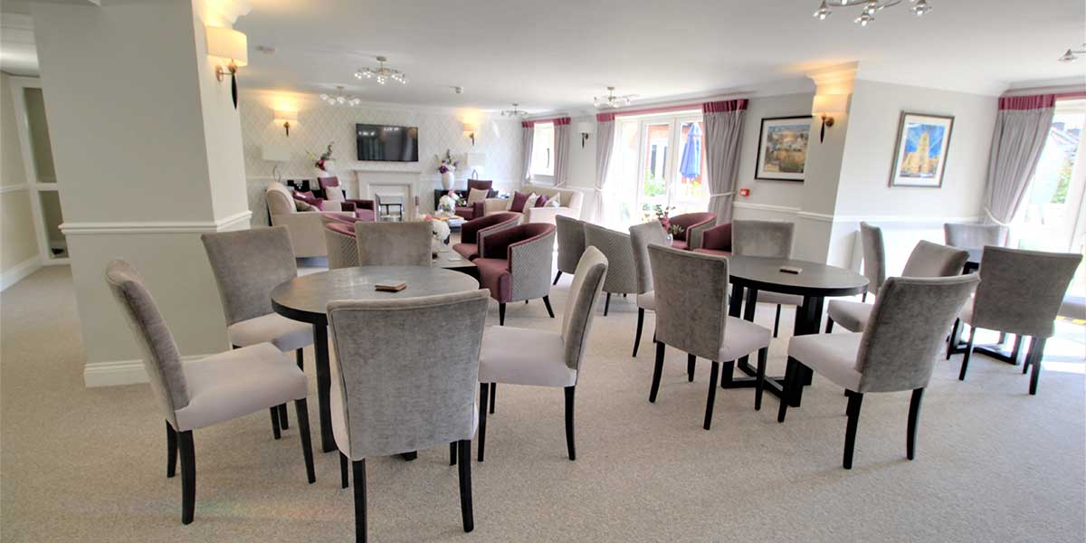 Interior common area with seating and tables.