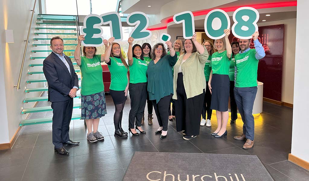Staff celebrating a fundraising milestone inside the facility.