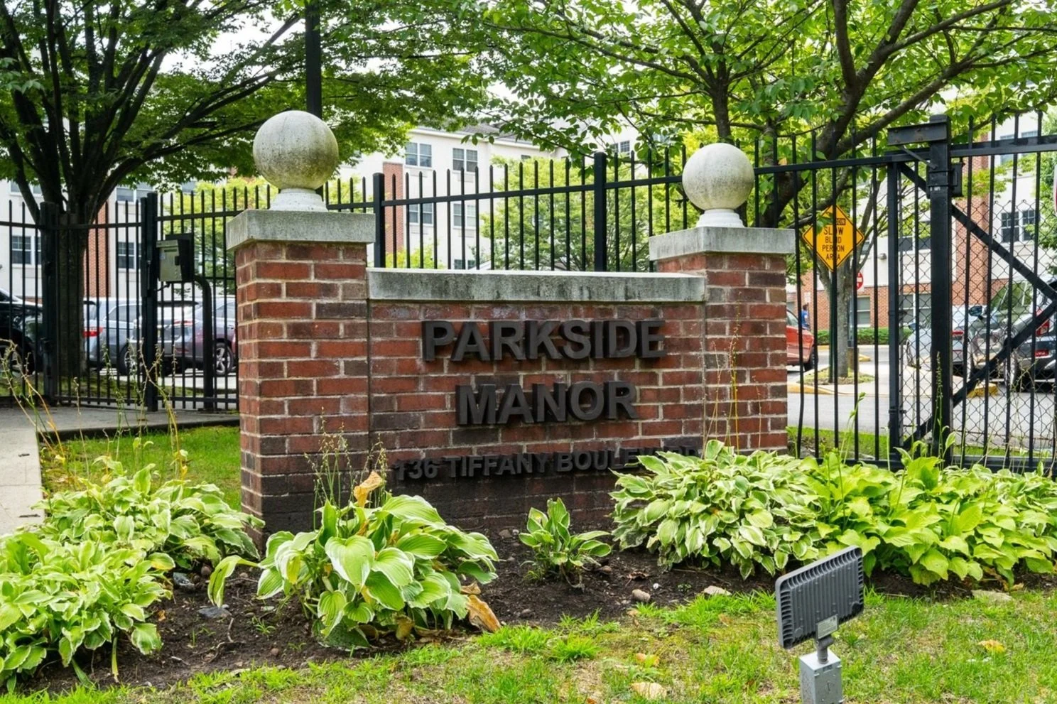 Signage for Parkside Manor facility with landscaping