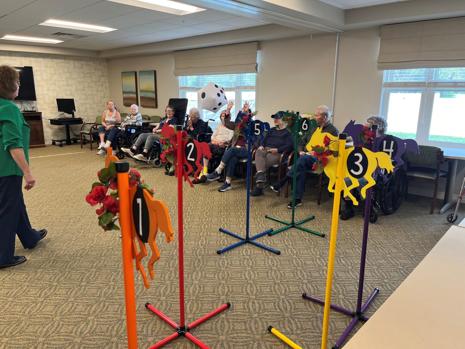 Residents participating in a lively activity game inside the facility