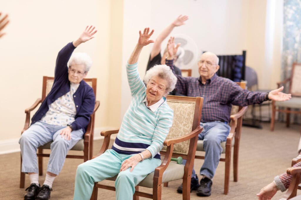Residents participating in an exercise activity in a common area