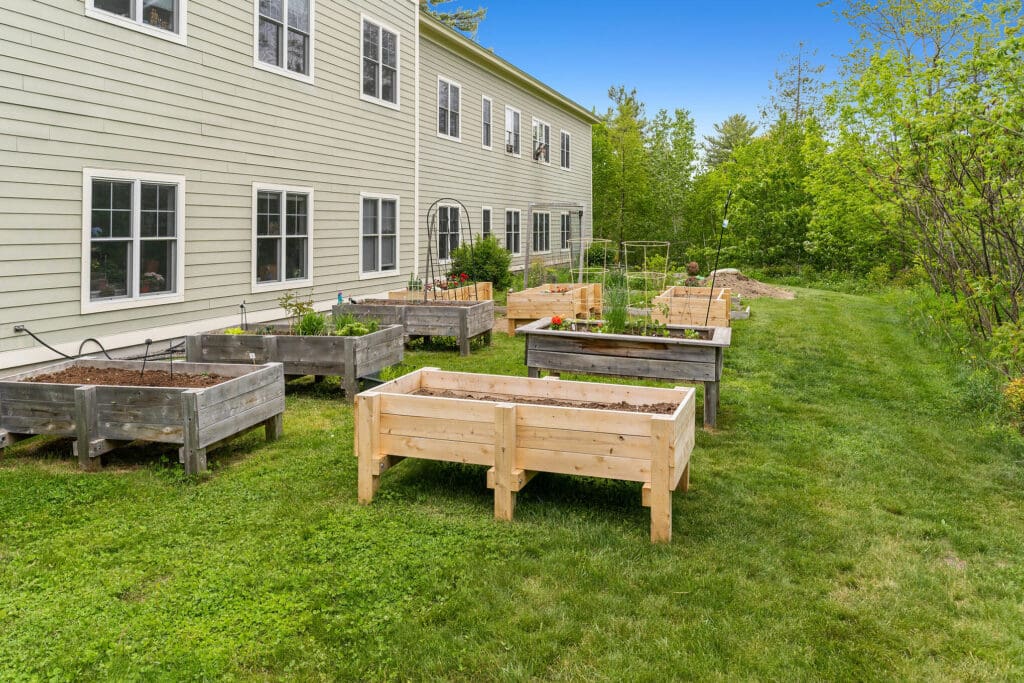 Raised garden beds outside a senior living facility
