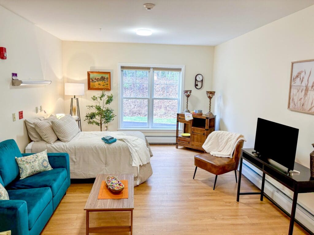 Private resident room with bed and seating area
