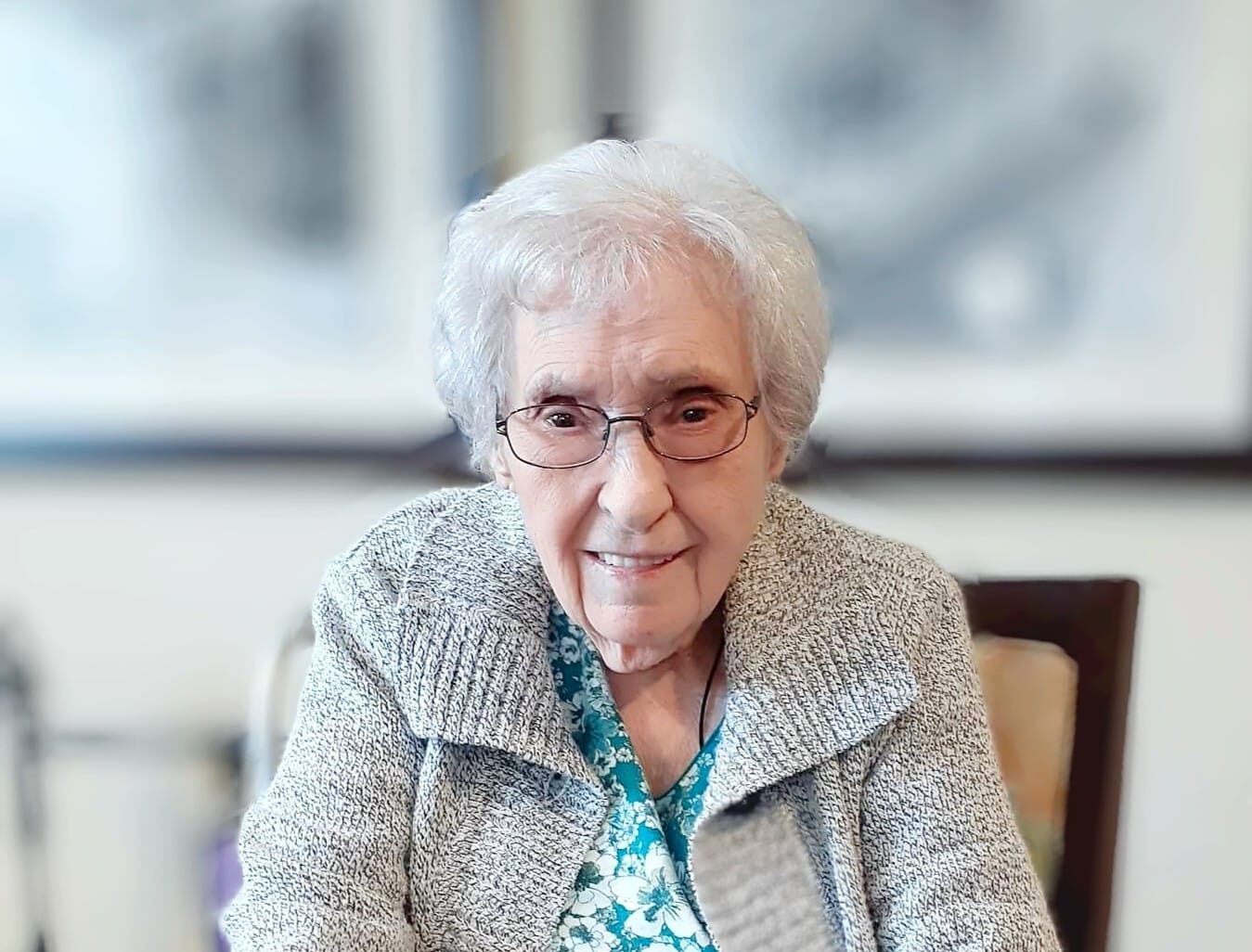 Smiling resident in a cozy indoor setting