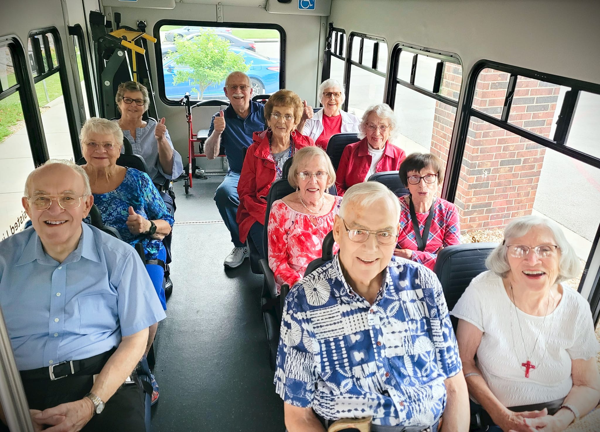 Residents enjoying a group outing on a bus