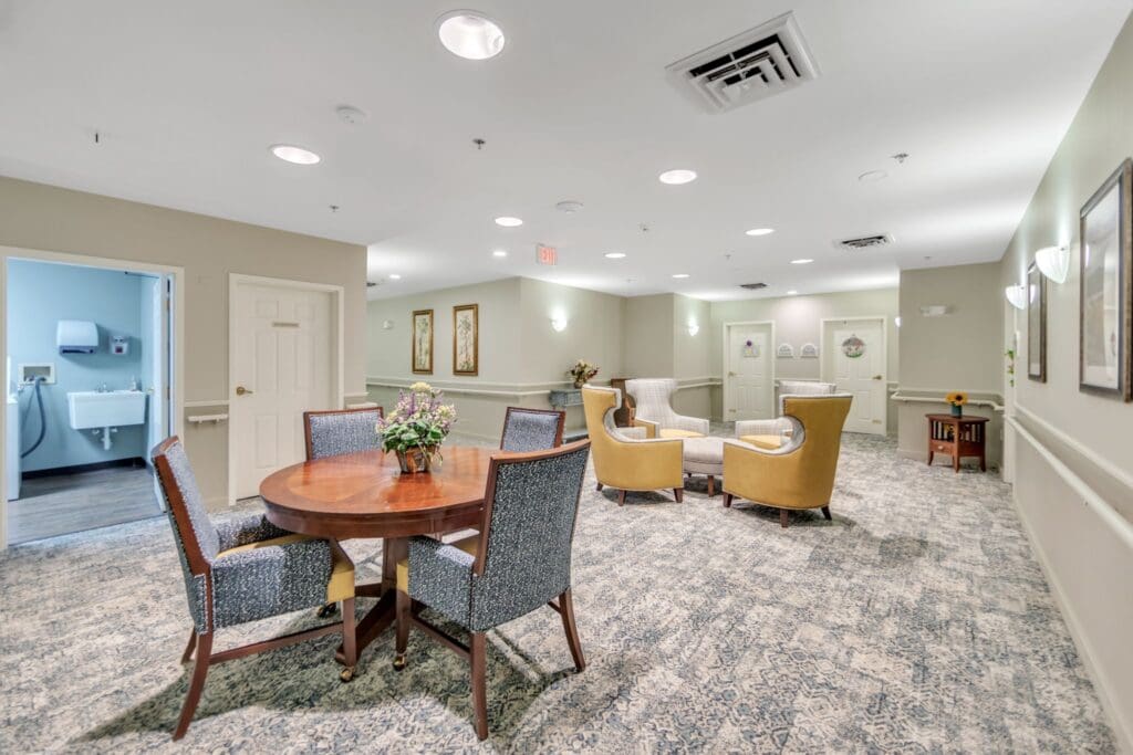 A cozy common area with seating and a dining table