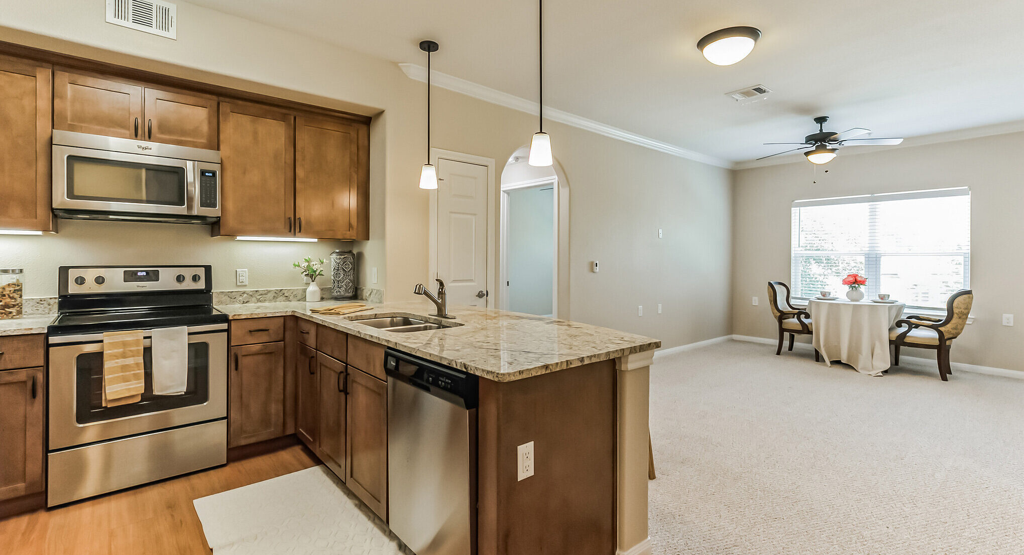 Bright kitchen and living area in a resident unit