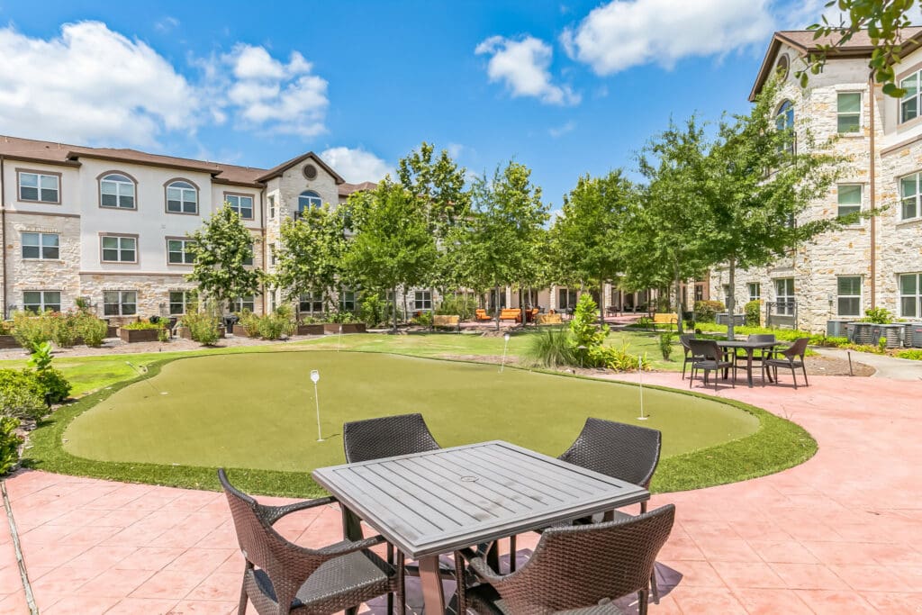 Outdoor courtyard with seating and greenery