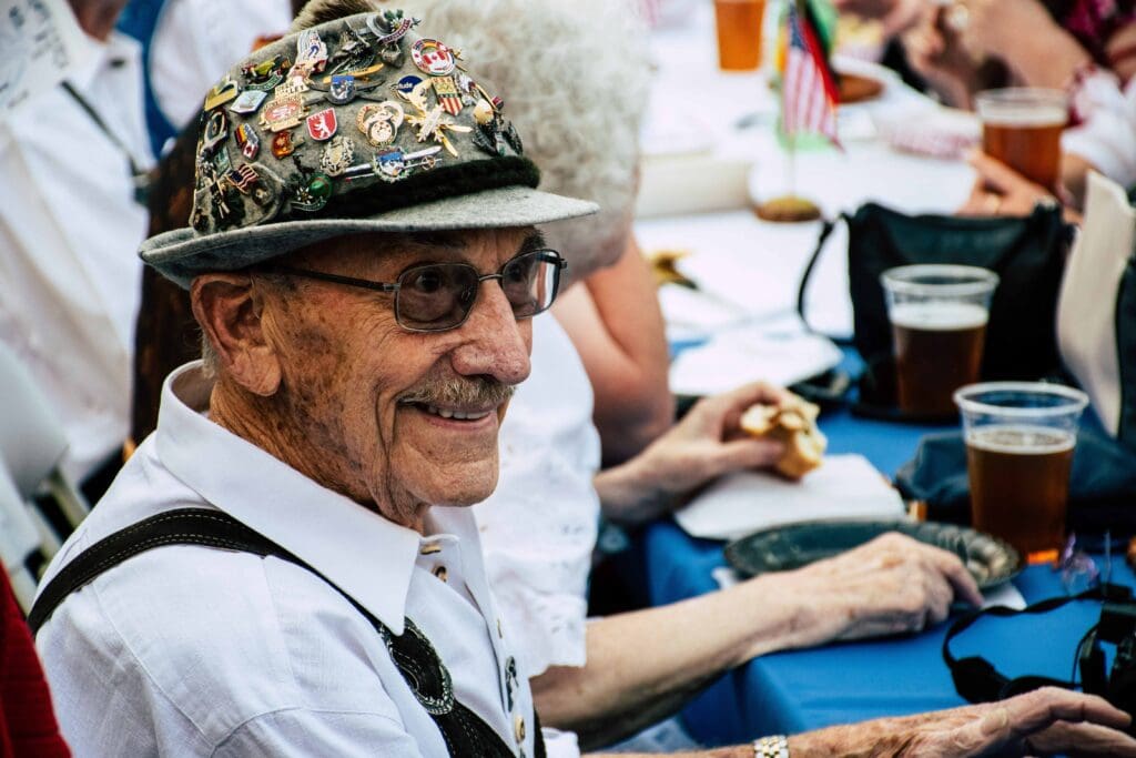Resident enjoying an outdoor event with drinks