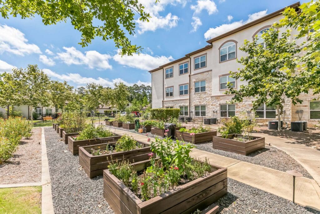 Exterior view of the facility with garden beds