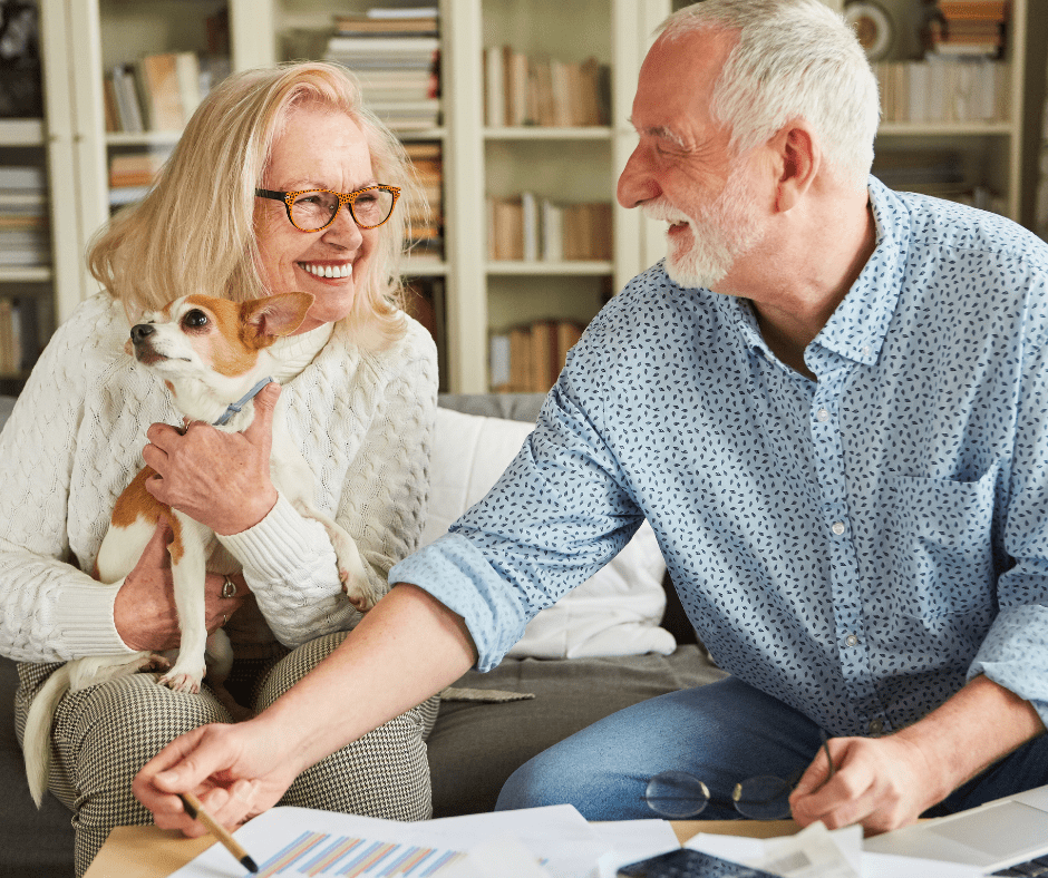 Couple enjoying each other's company with a dog in a cozy living space