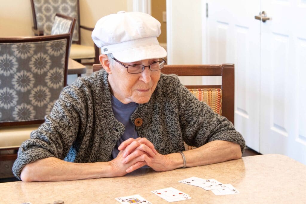 Resident playing cards in a common area