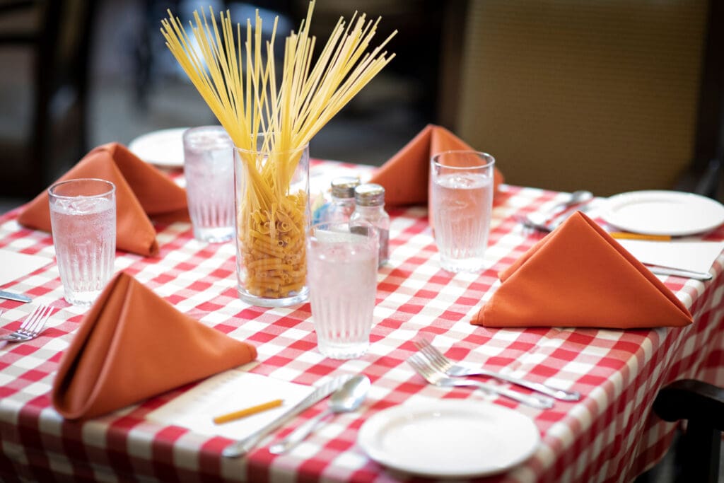 Dining table set with spaghetti centerpiece