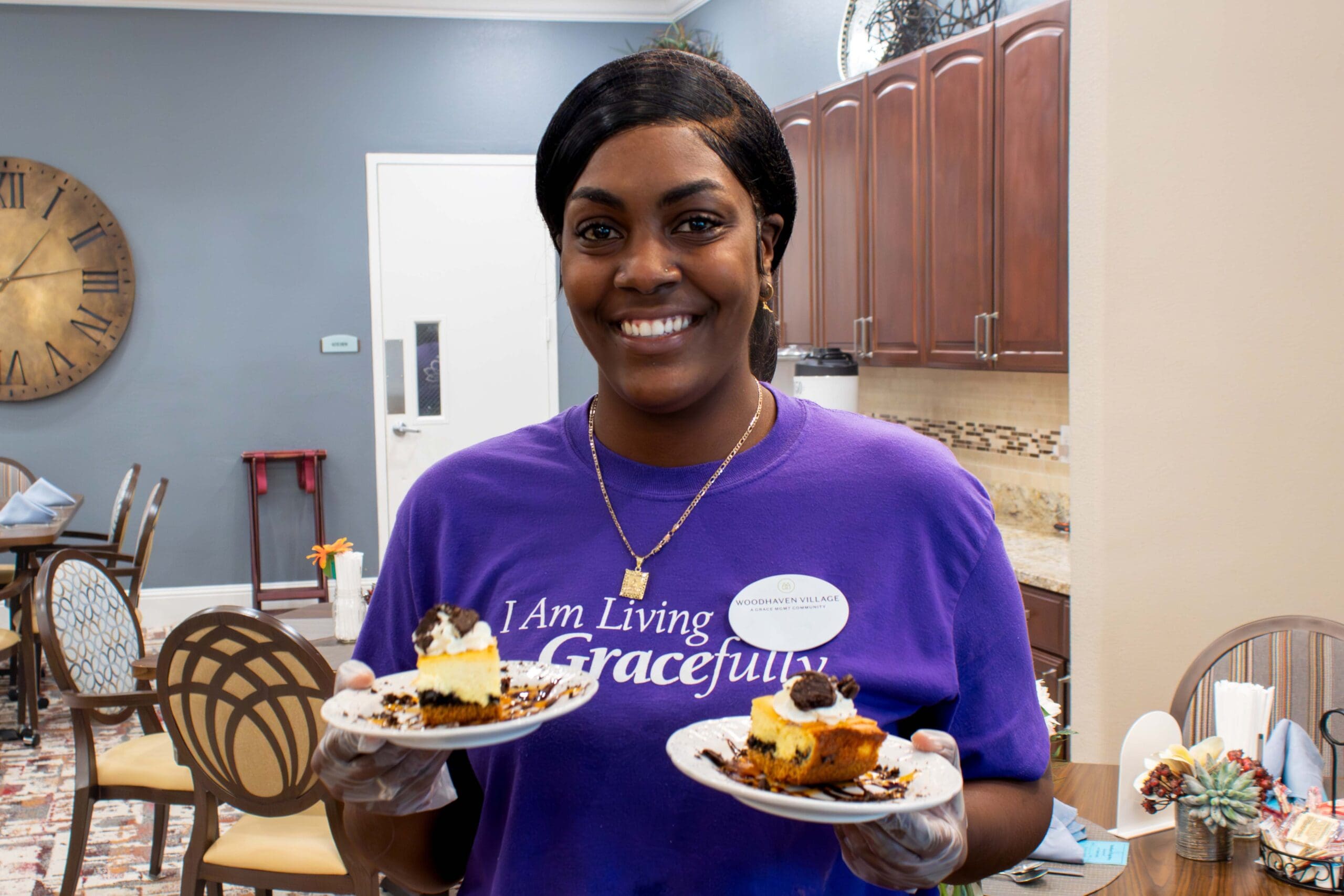 Staff member serving desserts in a dining area