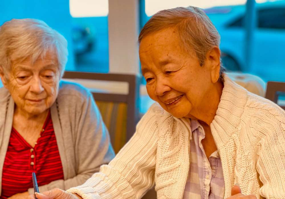 Two senior women engaged in conversation