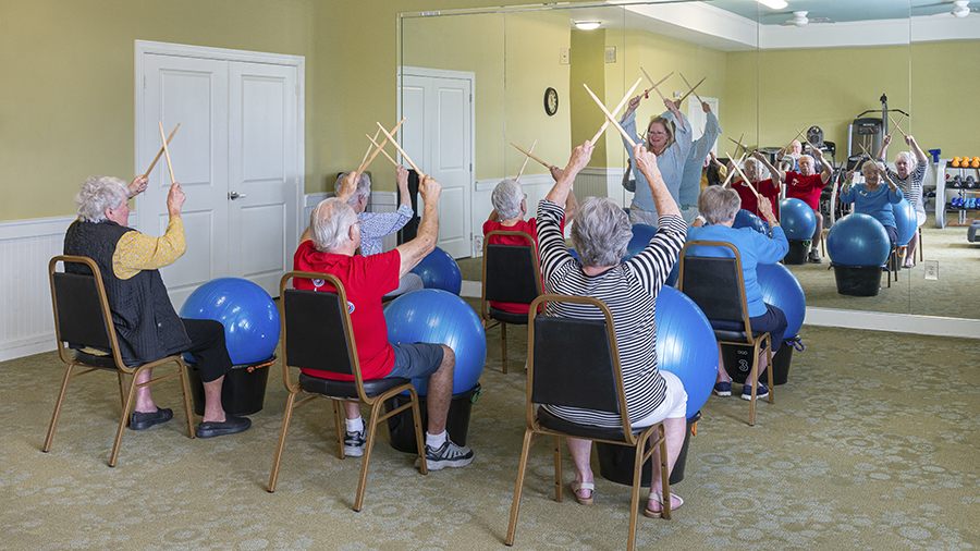 Residents participating in an exercise class with stability balls