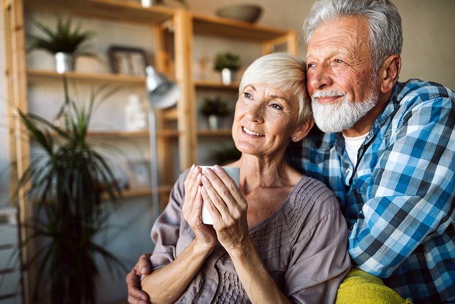 A happy elderly couple enjoying a moment together indoors