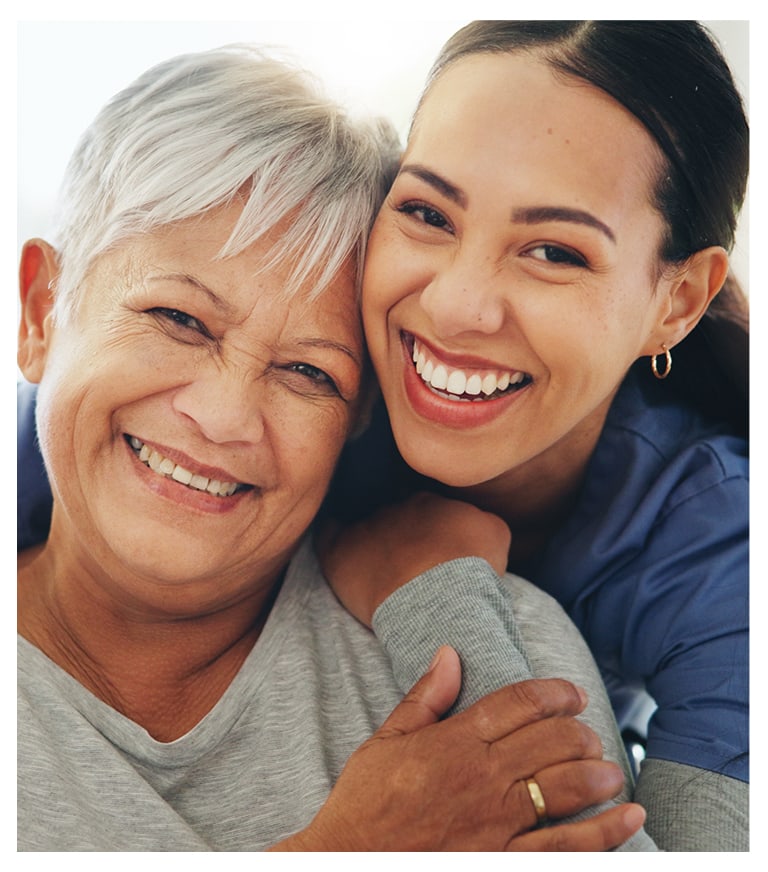 Two women smiling closely for the camera