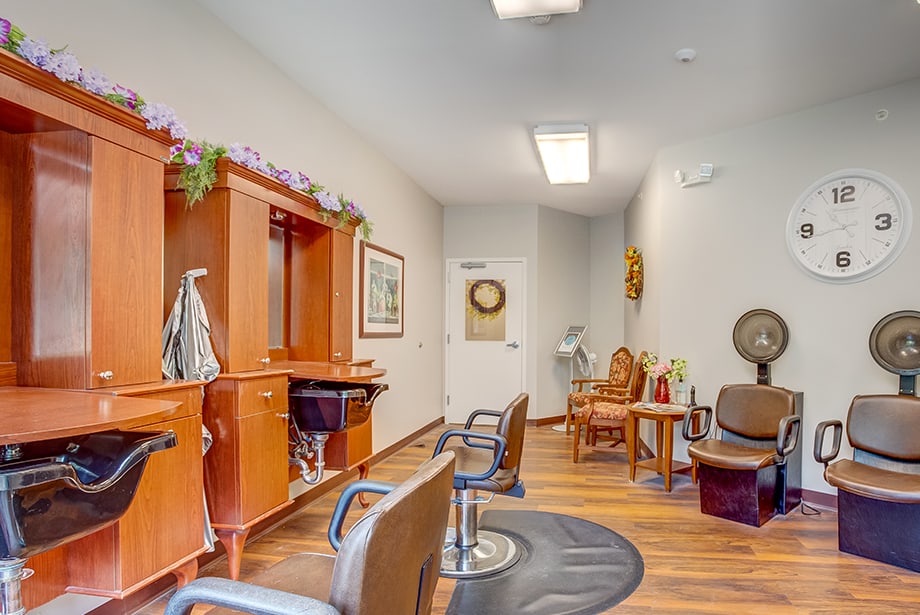 Salon area with styling chairs and mirrors