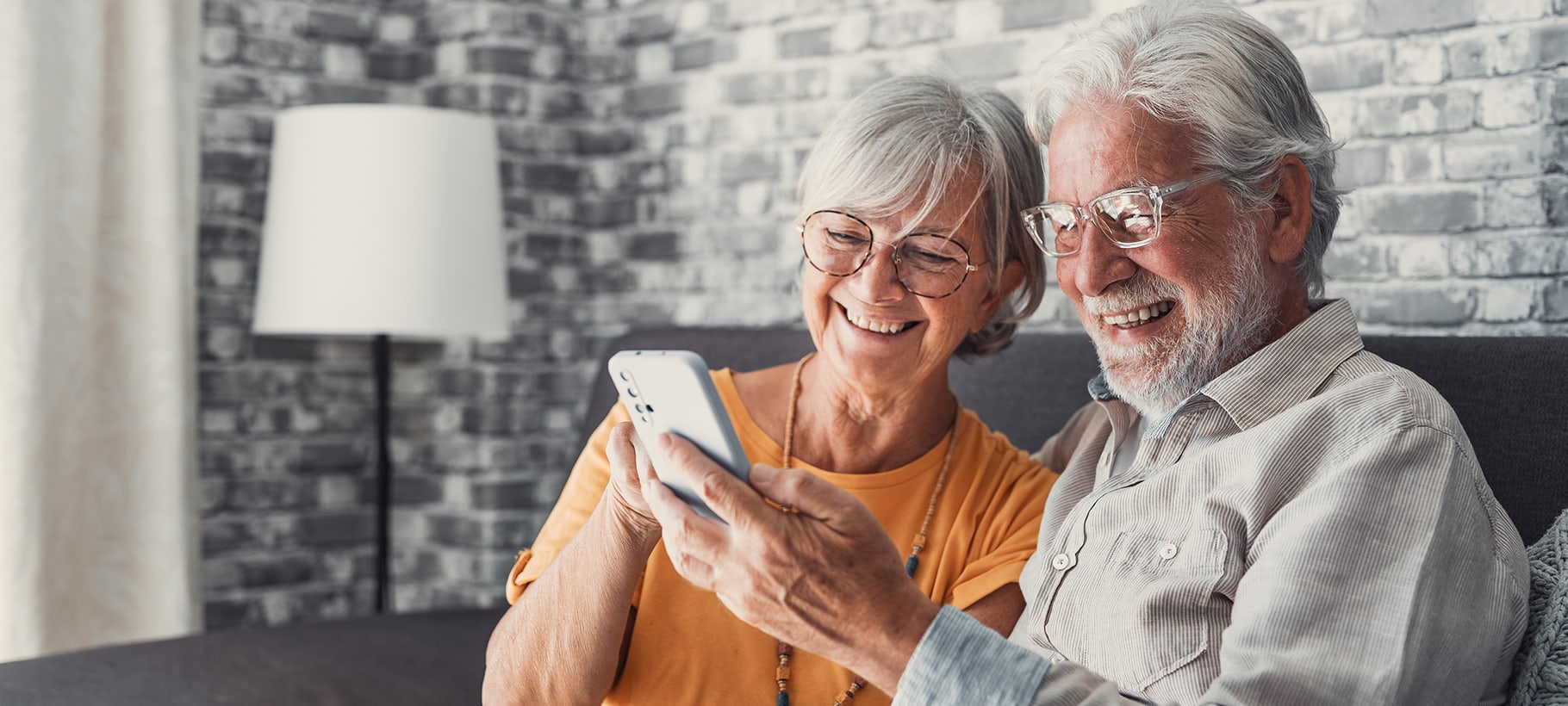 Senior couple enjoying time together with a smartphone