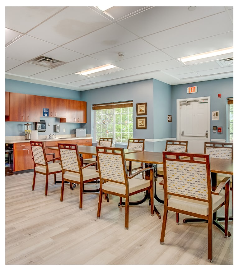 Bright common area with tables and chairs
