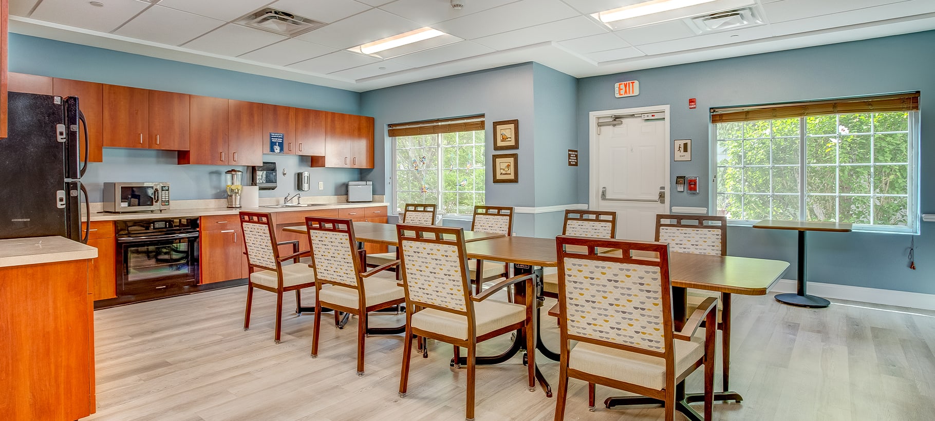 Dining area with tables and chairs in a well-lit room