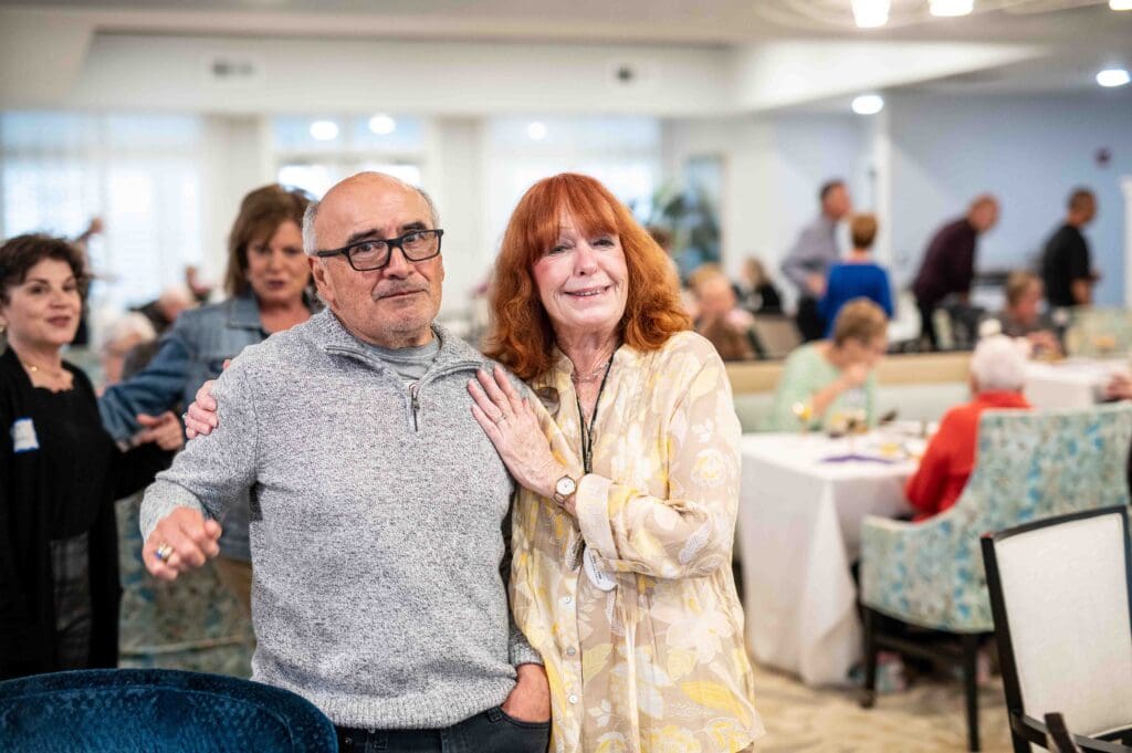 Two residents smiling in a vibrant common area