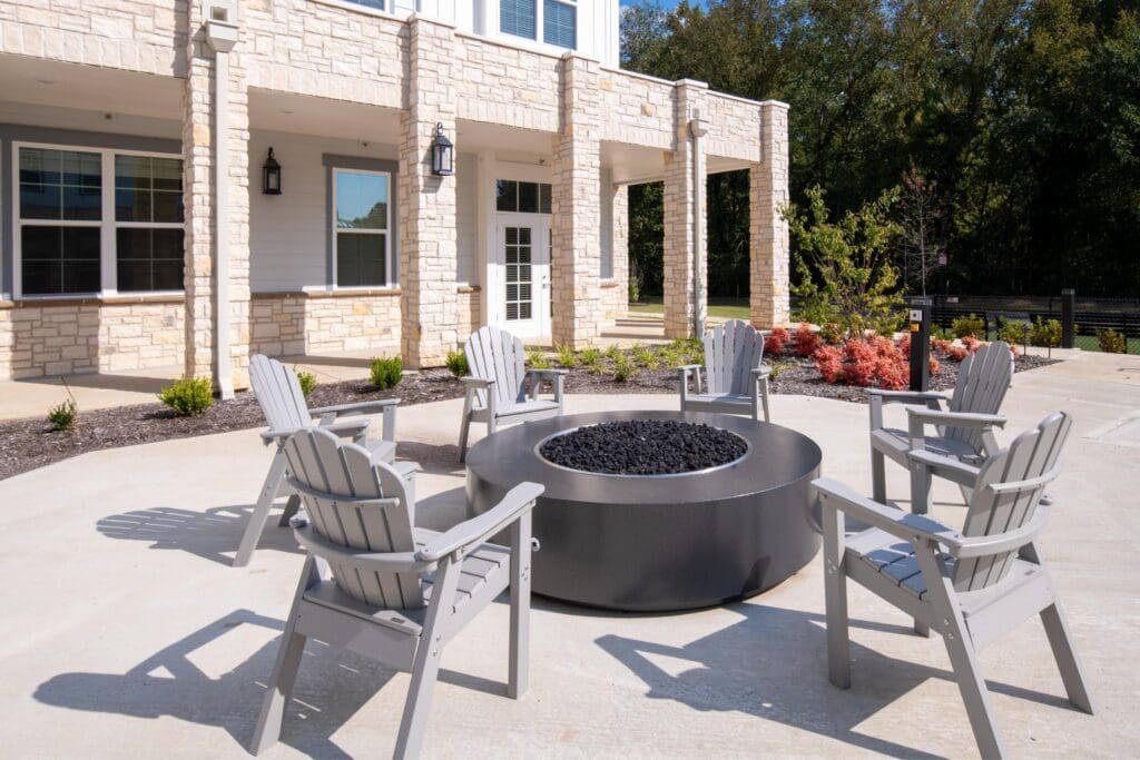 Outdoor seating area with fire pit at the facility