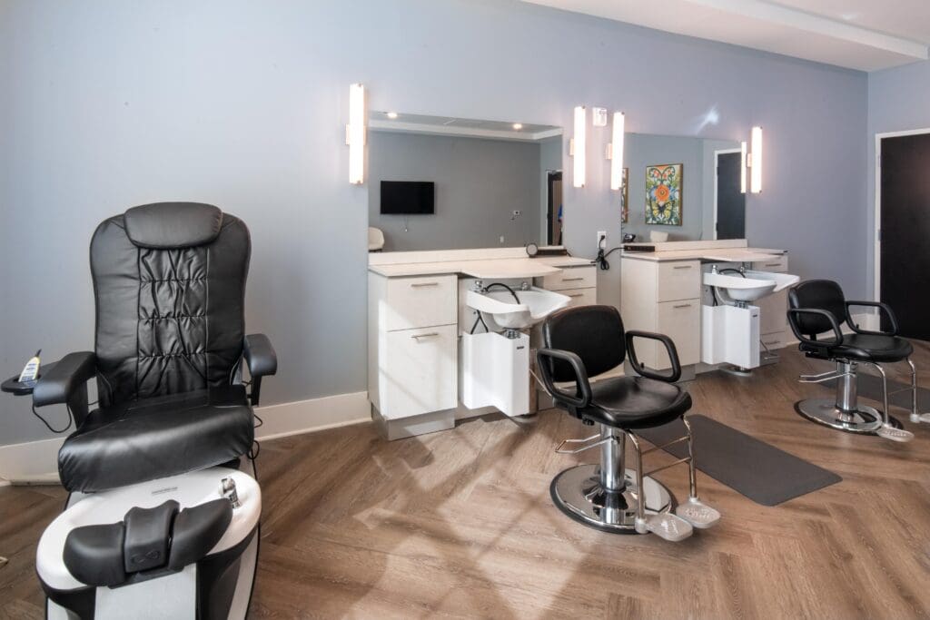 Interior view of a beauty salon with styling chairs