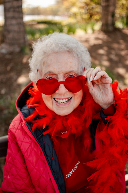 Resident wearing fun heart-shaped sunglasses outdoors