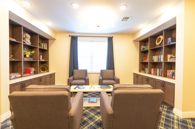 Cozy common area with bookshelves and seating