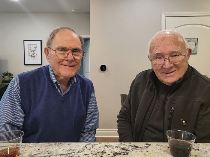 Two residents enjoying drinks at a social gathering