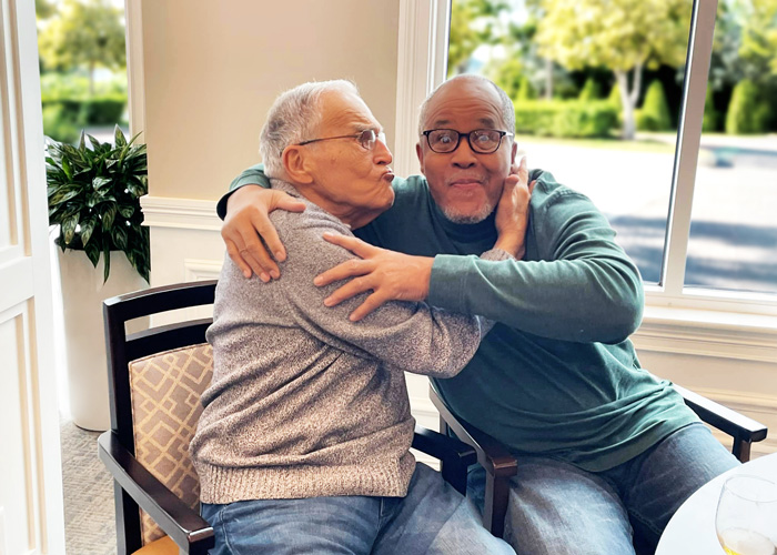 Two residents enjoying time together in a common area