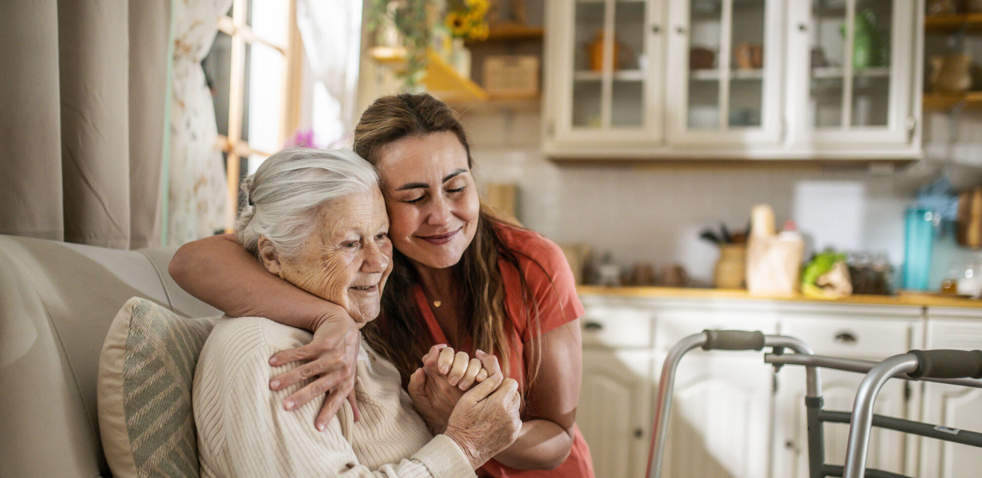 A caregiver embracing a senior resident in a cozy interior