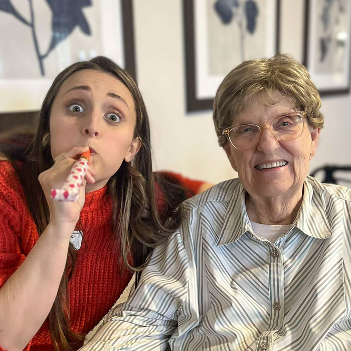 A resident and a staff member celebrating together