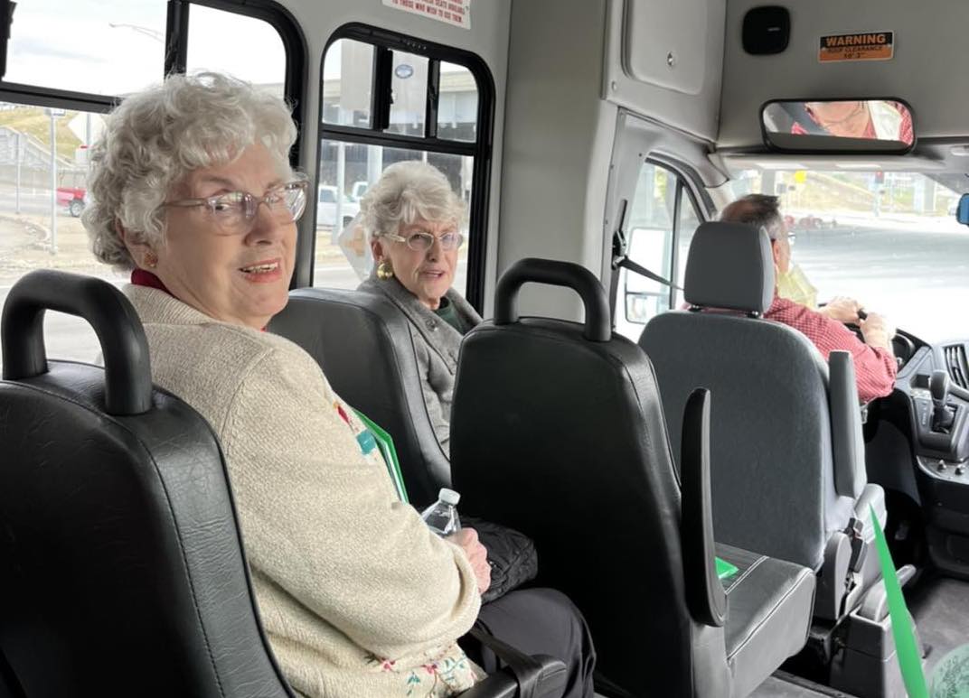 Residents enjoying a ride in the facility van