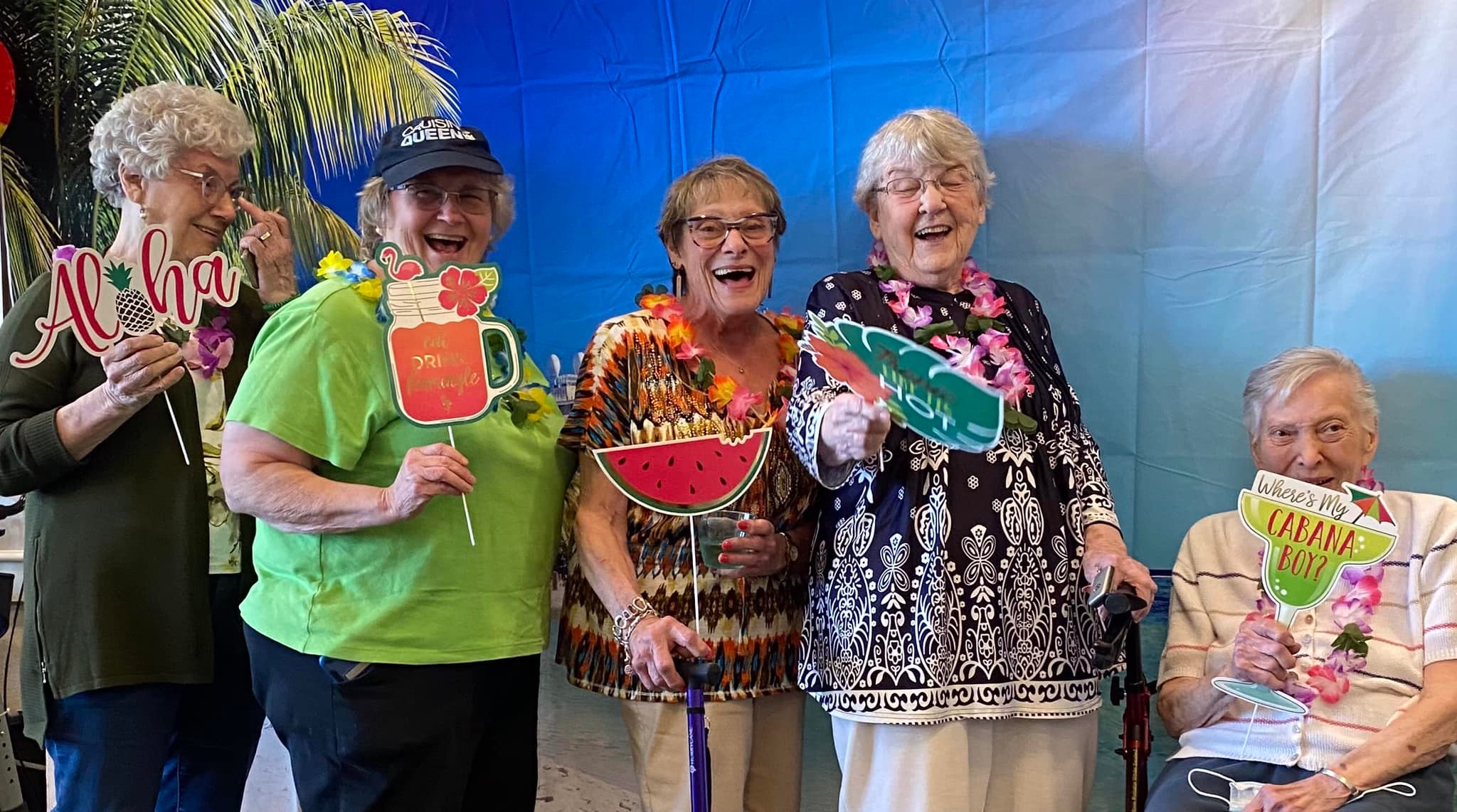 Residents celebrating with props at a themed event