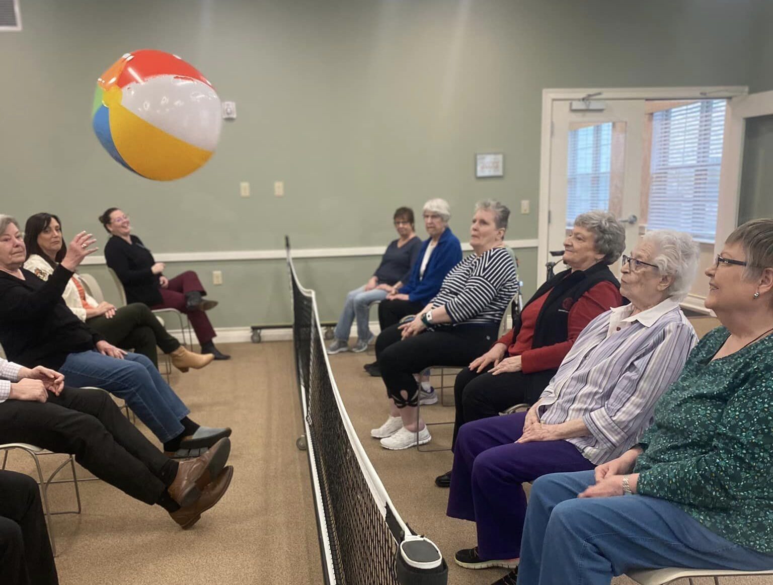 Residents engaged in an activity with a beach ball