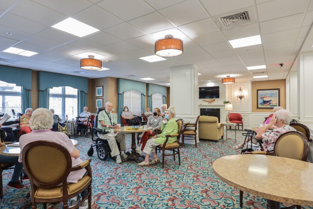 Residents enjoying a social activity in a community common area.