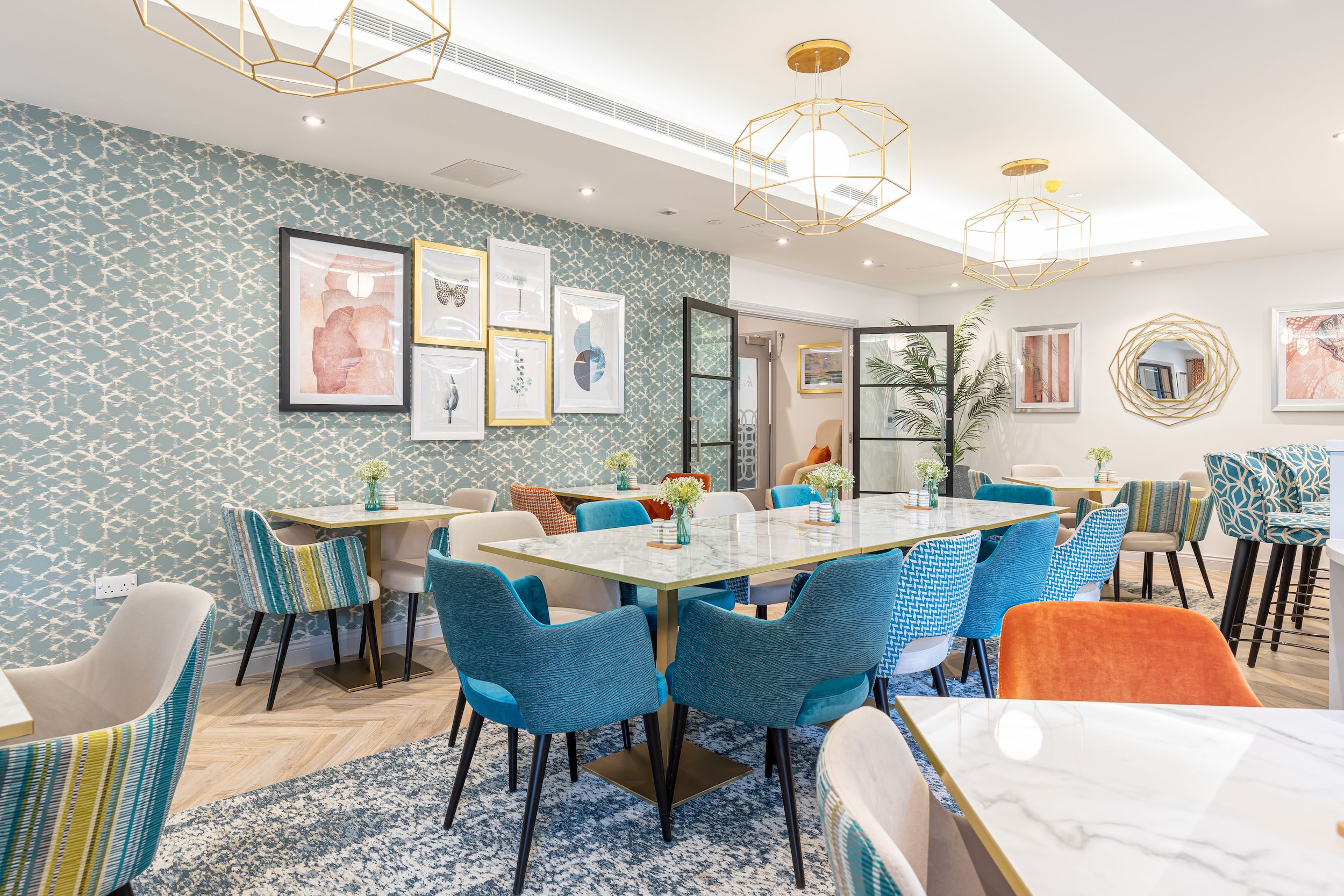 Bright dining area with colorful chairs and decor