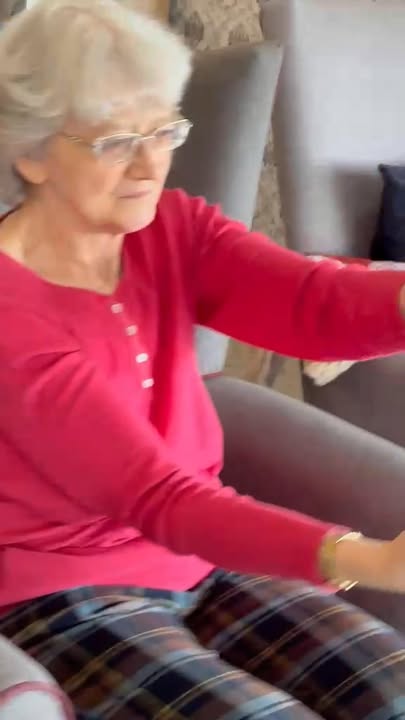 Senior woman engaging in an activity in the lounge area