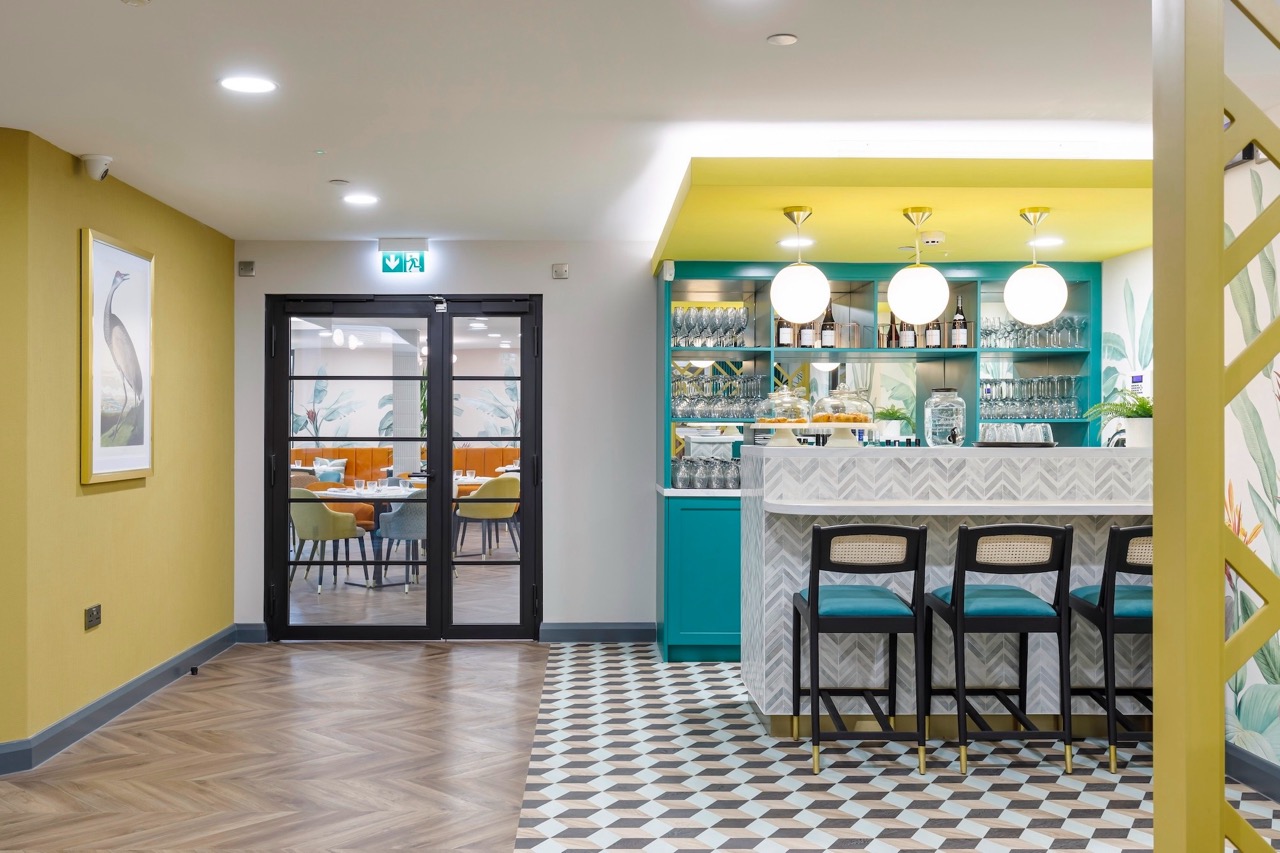 Interior view of a vibrant dining area with a bar.