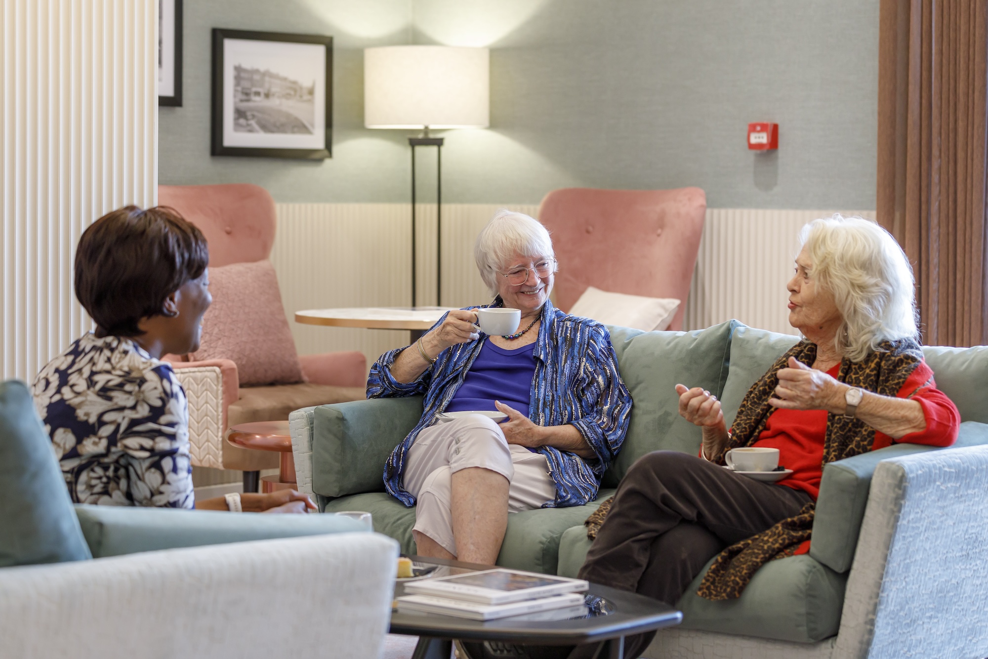 Residents enjoying conversation in a cozy common area