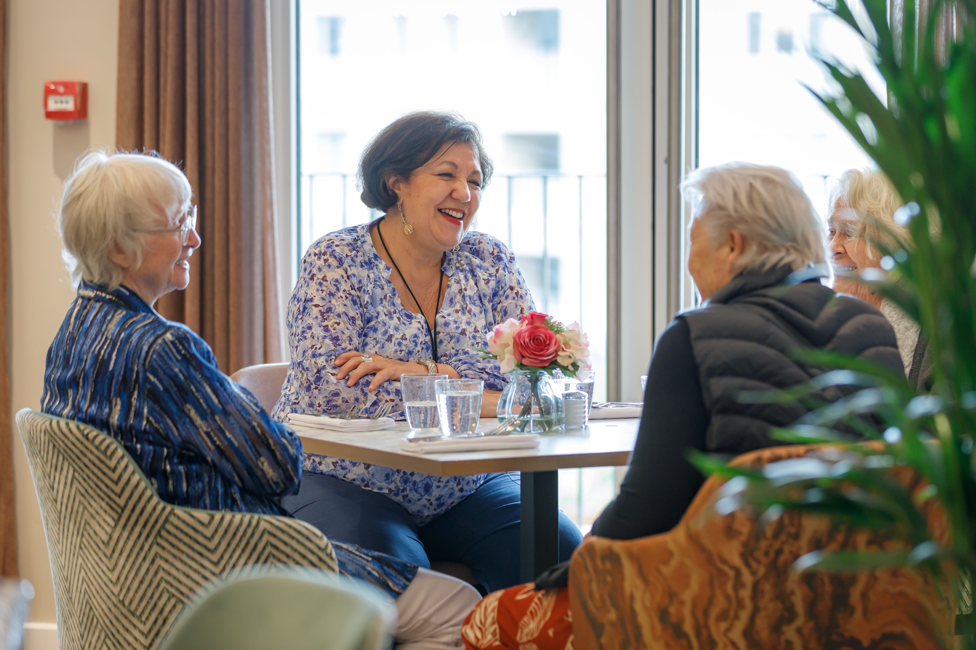 Residents enjoying a conversation in a common area
