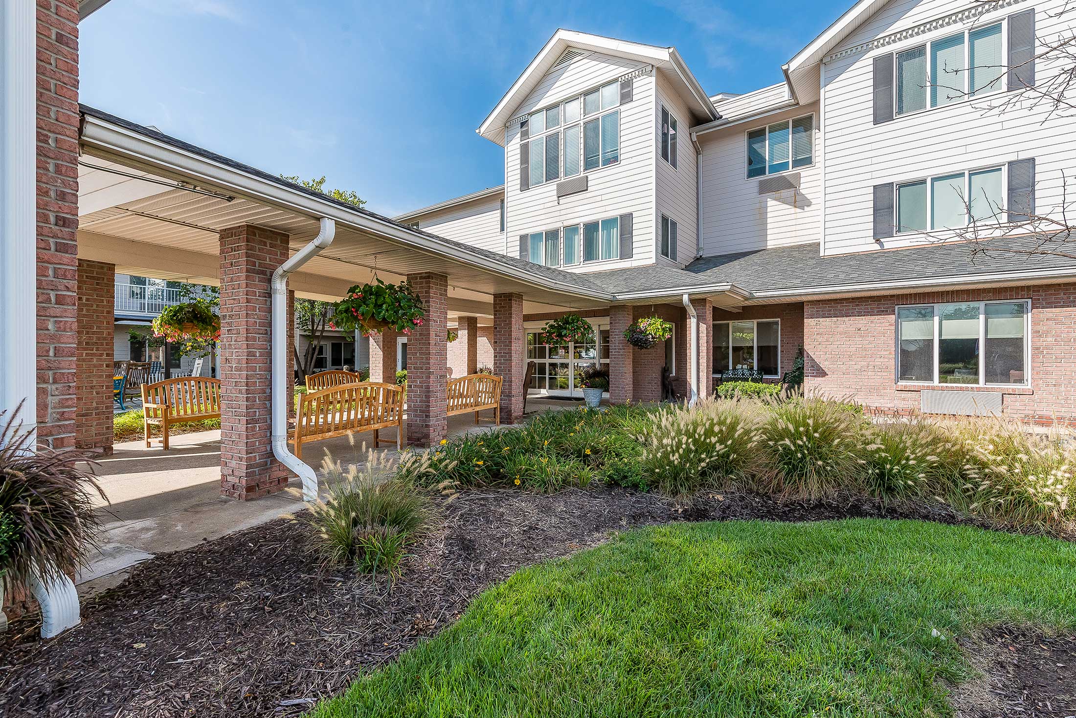 Outdoor seating area with green landscaping
